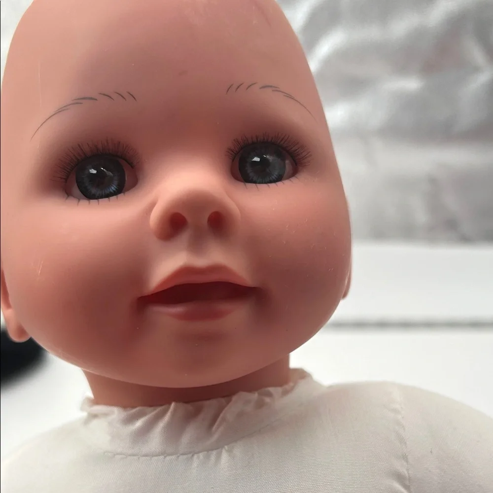 Realistic Baby Doll with White Outfit